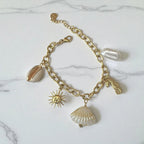 Bracelet doré breloque theme coquillage Rklisa
