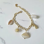 Bracelet doré breloque theme coquillage Rklisa