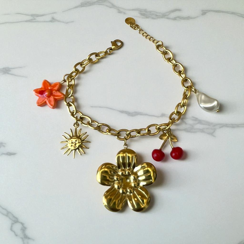 Bracelet doré breloque fleur cerise soleil et perle Rklisa