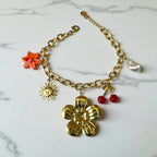 Bracelet doré breloque fleur cerise soleil et perle Rklisa