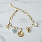 Bracelet chaîne dorée breloques de la mer bleu Rklisa