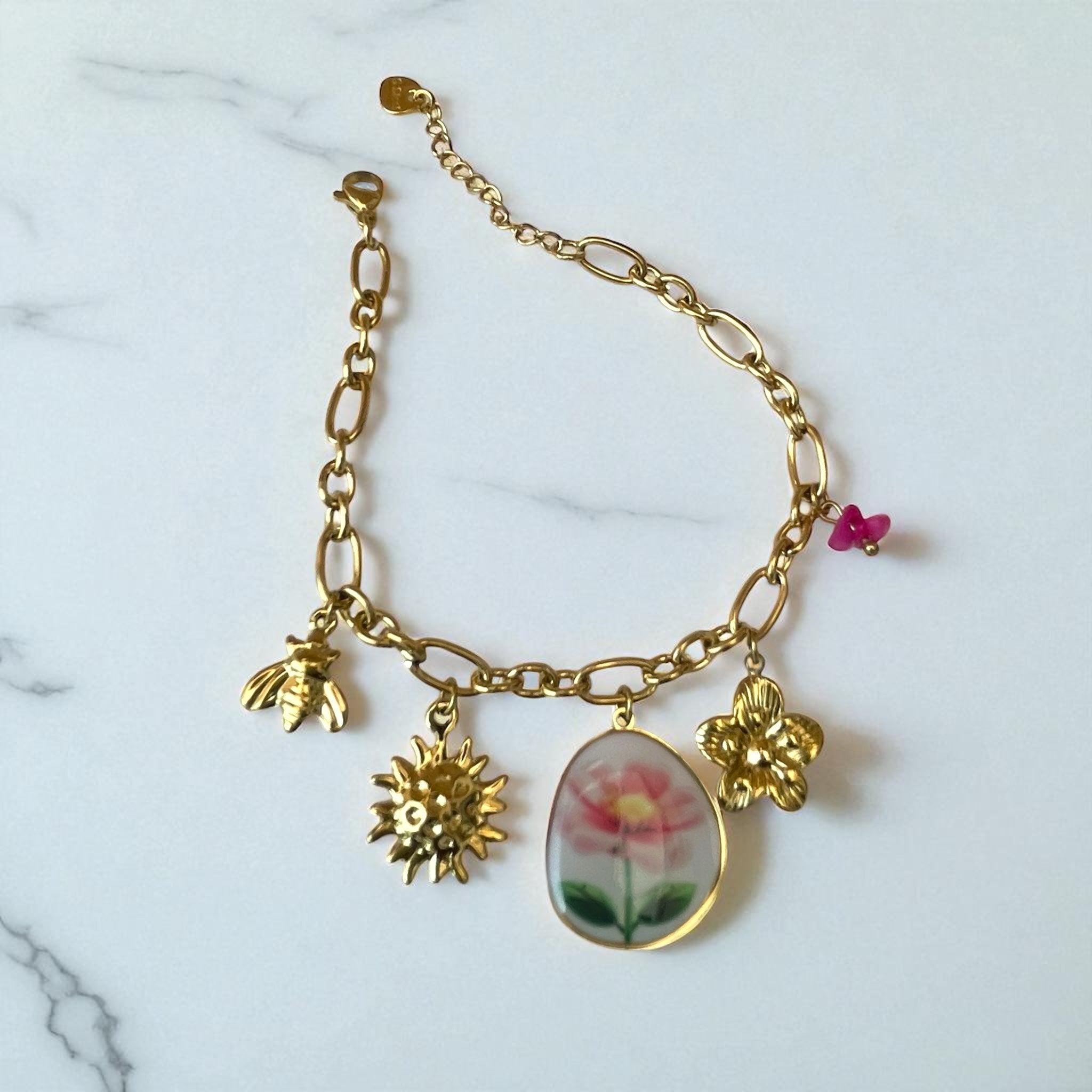 Bracelet chaîne dorée avec charms fleur dessinée Rklisa
