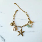 Bracelet doré charms étoile de mer coquillage perle Rklisa