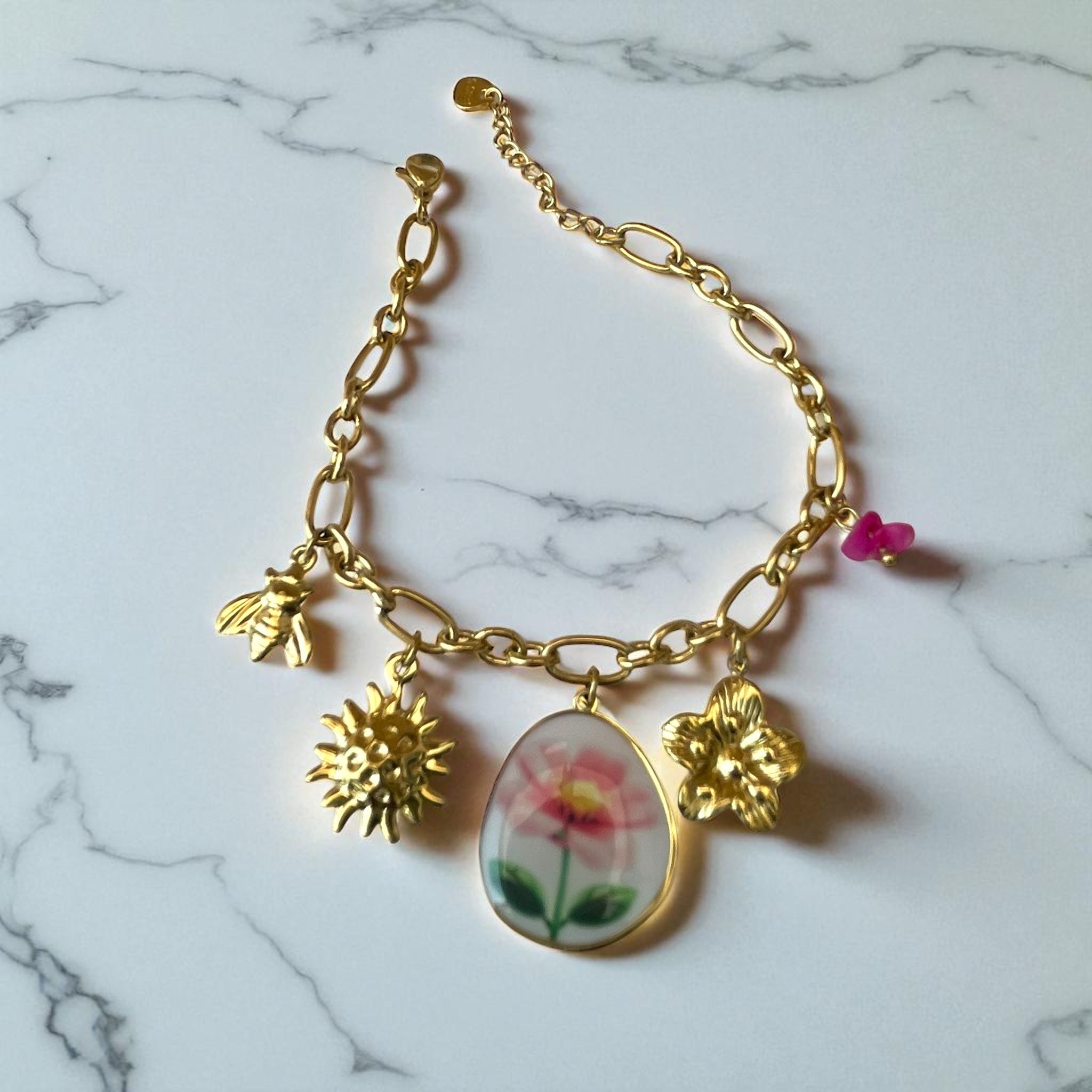 Bracelet chaîne dorée avec charms fleur dessinée Rklisa